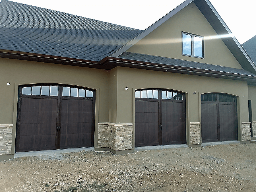 New Garage Door - Model 5602 Carriage with Accents Overlay in a Walnut Wood Tone