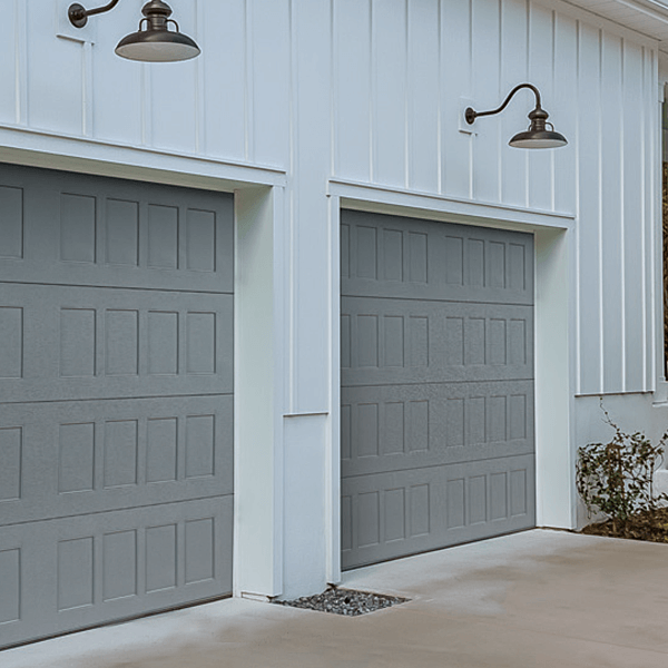 Stamped Carriage Short Garage Door shown in accents Woodtones Cedar