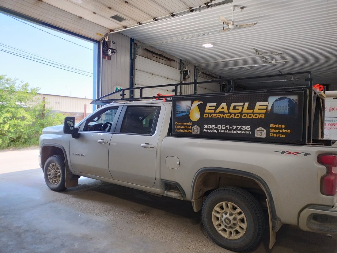 Eagle Overhead Door service truck inside a shop with the overhead door open