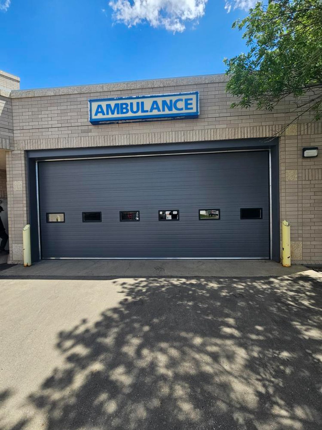 Dark commercial overhead door on an emergency services station