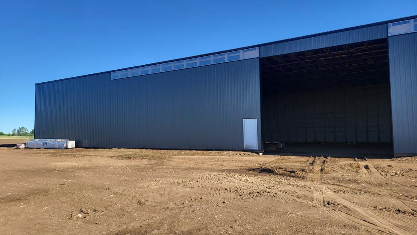 Long commercial building with overhead doors along the side