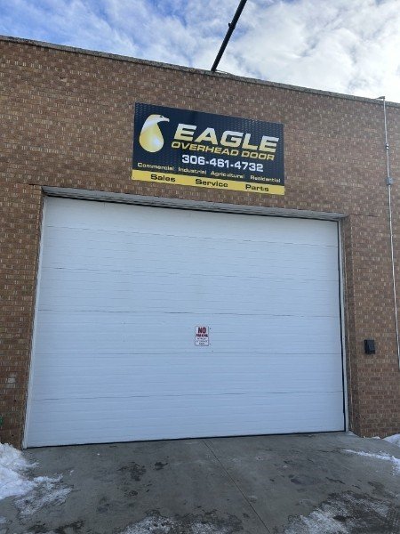 Eagle Overhead Door shop front with a white commercial overhead door