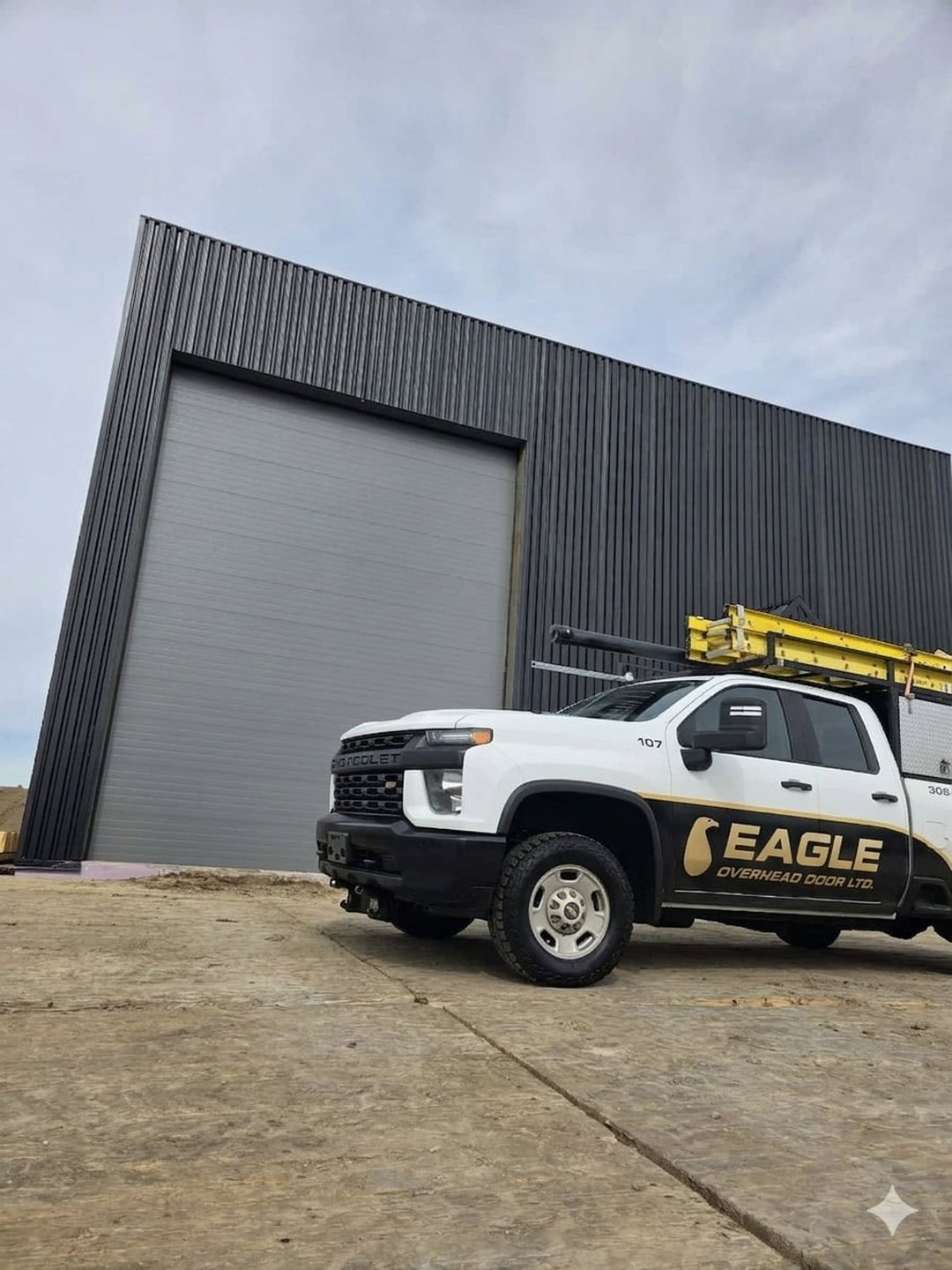 Eagle Overhead Door service truck outside a commercial building